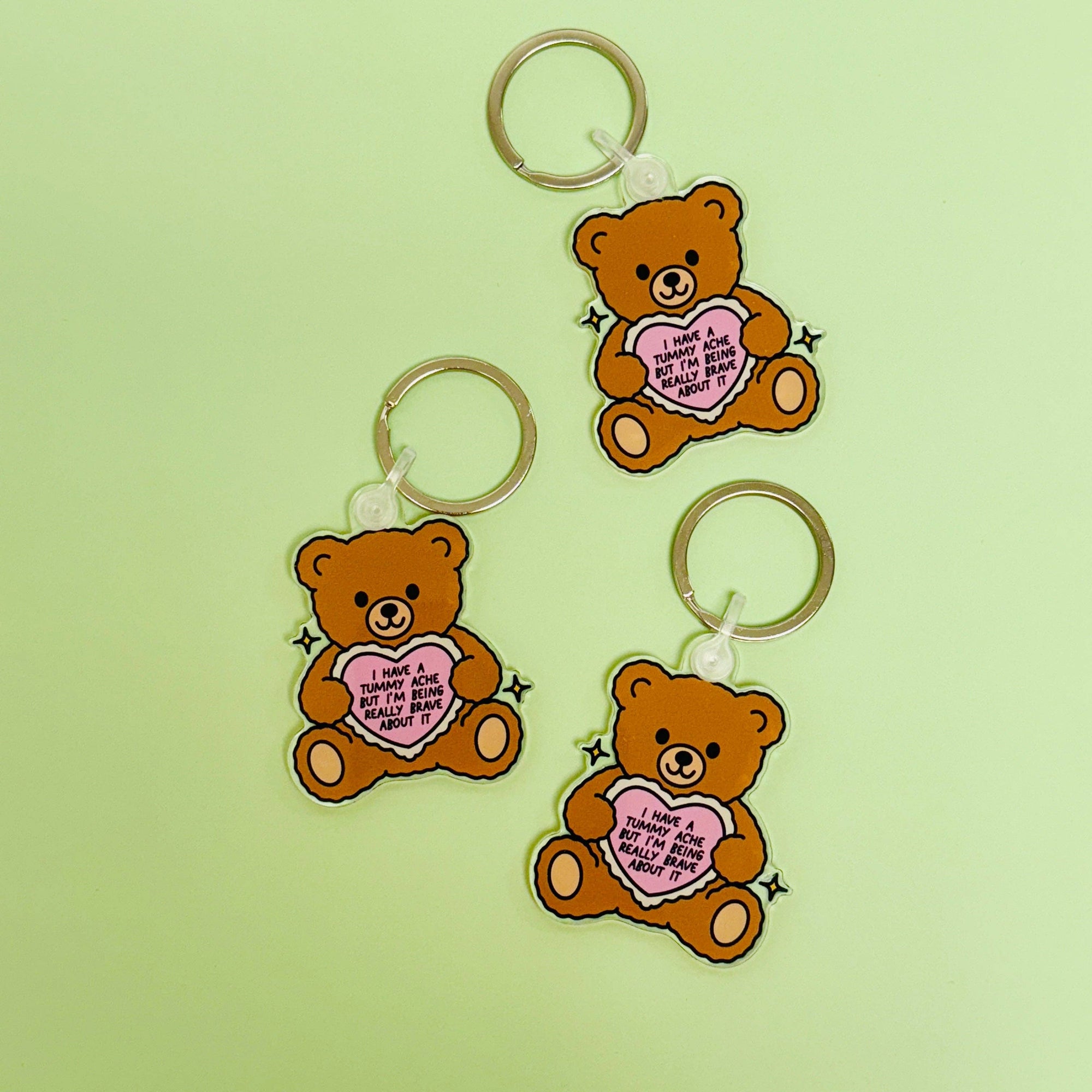 Sonny Rising - Acrylic Keychain, My Tummy Hurts Teddy Bear